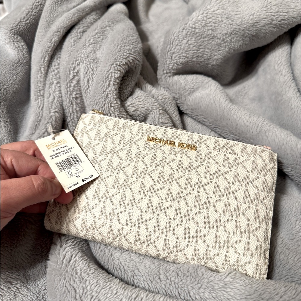 New Michael Kors Jet Set Travel
Double zip Wristlet. 
Originally $258.00